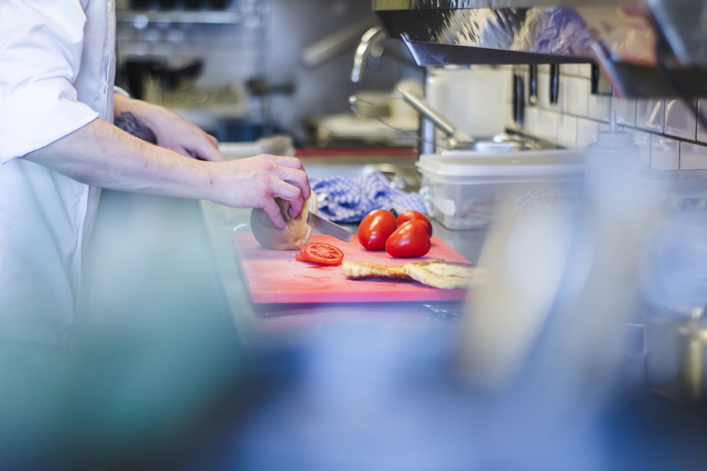 Hands preparing ingredients on a kitchen counter