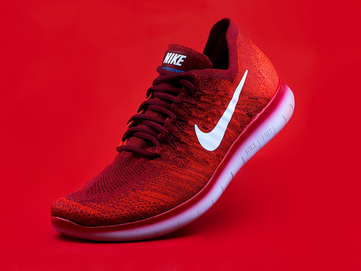 A pair of running shoes photographed against a plain backdrop